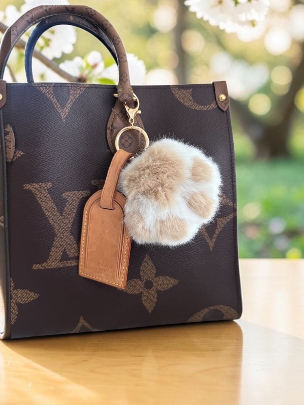 Louis Vuitton  Leather Tag with Unbranded Fur Paw Bag Charm